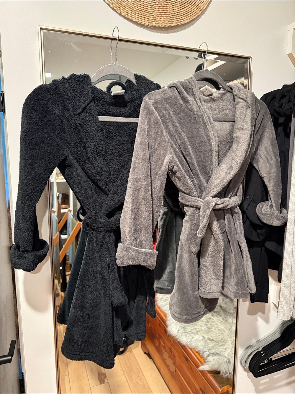 Two hooded fleece bathrobes with pockets